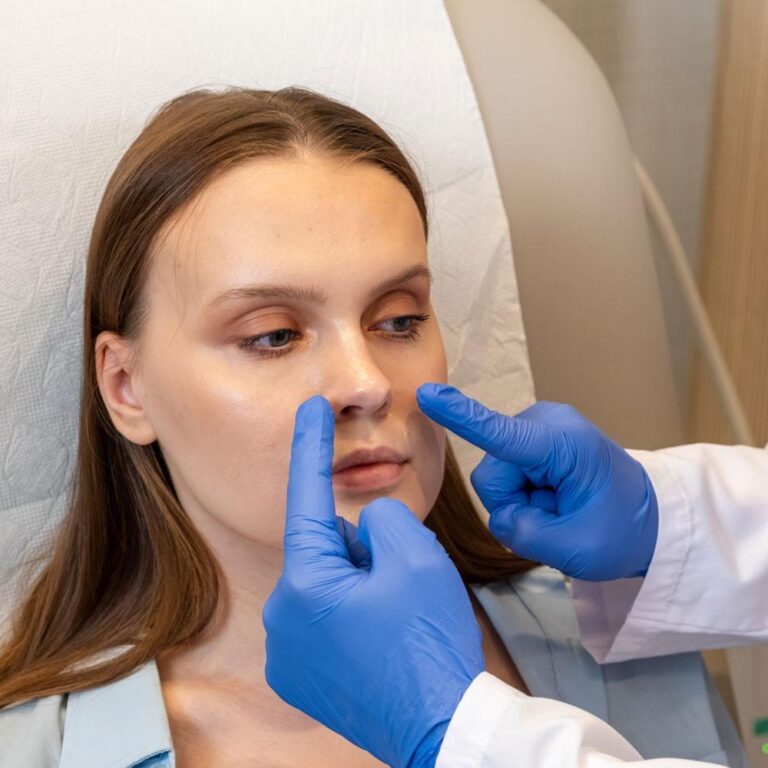 Nose Reshaping Surgery Procedure pre-operative nasal examination performed during rhinoplasty consultation.